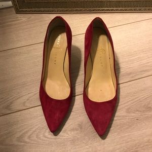 Red suede pumps
